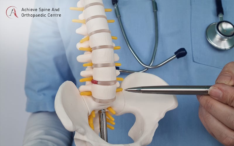 Doctor pointing out point of degeneration