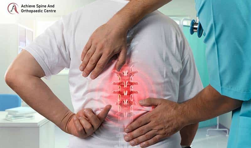 Doctor doing spine pain treatment for patient.
