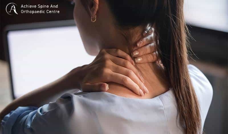 woman experiencing neck pain.