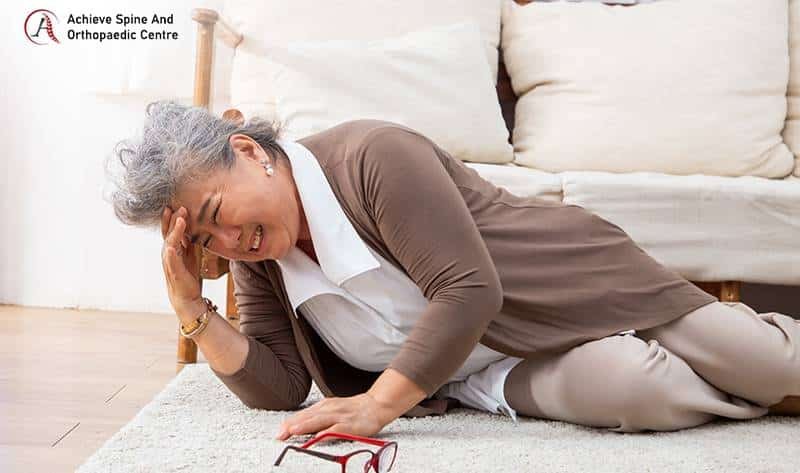 Elderly woman falling and getting a headache.