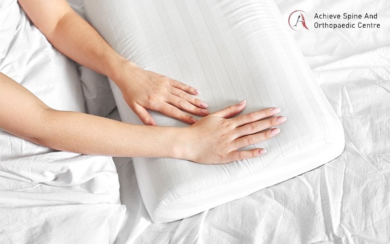 Supportive pillow for herniated disc recovery.